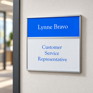Office signs with changeable inserts mounted on the latch side of office doors
